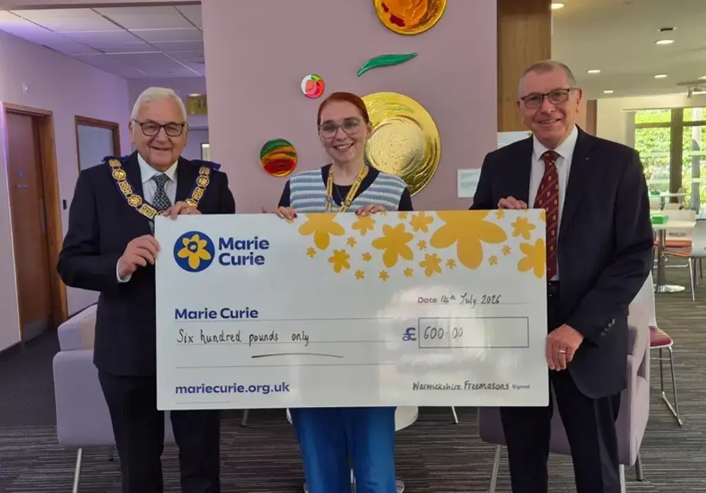 Ian Copestake and Mark Phillips presented the cheque to Harri Smith of the Marie Curie Fundraising Team